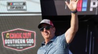 FILE - Former driver Greg Biffle waves to fans prior to a NASCAR Cup Series auto race at Darlington Raceway, Aug. 31, 2025, in Darlington, S.C. (AP Photo/Matt Kelley, File)