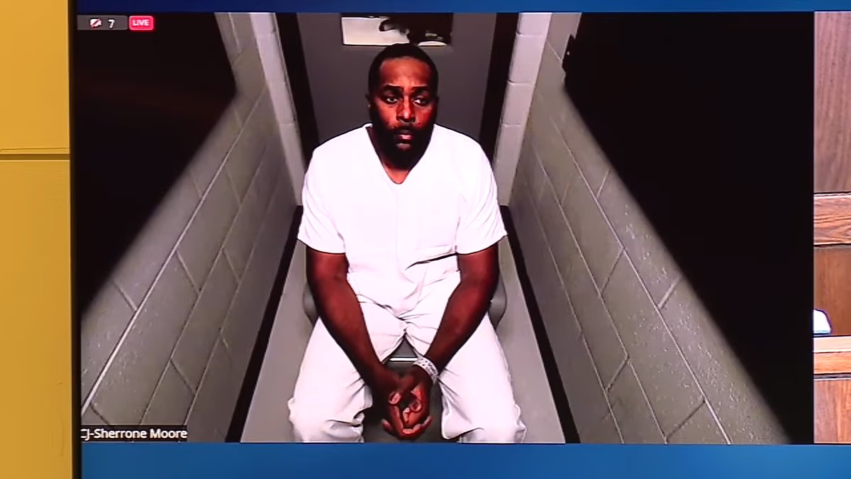 Fired Michigan coach Moore charged with home invasion and stalking