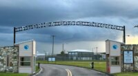 FILE - Clouds hover over the entrance of the Florida State Prison in Starke, Fla., Aug. 3, 2023. (AP Photo/Curt Anderson, file)