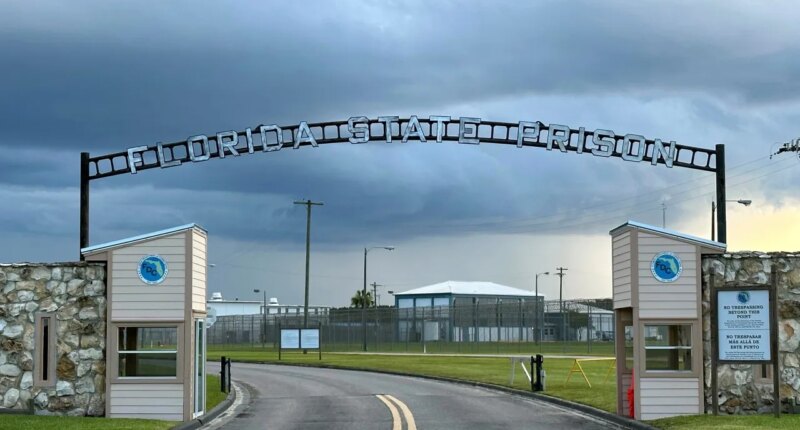 FILE - Clouds hover over the entrance of the Florida State Prison in Starke, Fla., Aug. 3, 2023. (AP Photo/Curt Anderson, file)