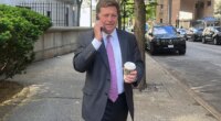 FILE - Acting U.S. Attorney for the Southern District of New York Jay Clayton talks on a phone as he exits court in New York, May 19, 2025. (AP Photo/Ted Shaffrey, File)