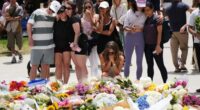 Emotions are high as locals continue to flock to Bondi Beach to lay flowers.