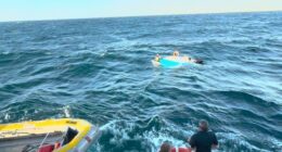 Heavy swell threw the four men out of their 5.7 aluminium cruiser into the ocean.