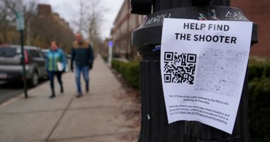 A poster seeking information about the campus shooting suspect is seen on the campus of Brown University, Wednesday, Dec. 17, 2025, in Providence, R.I. (AP Photo/Robert F. Bukaty)