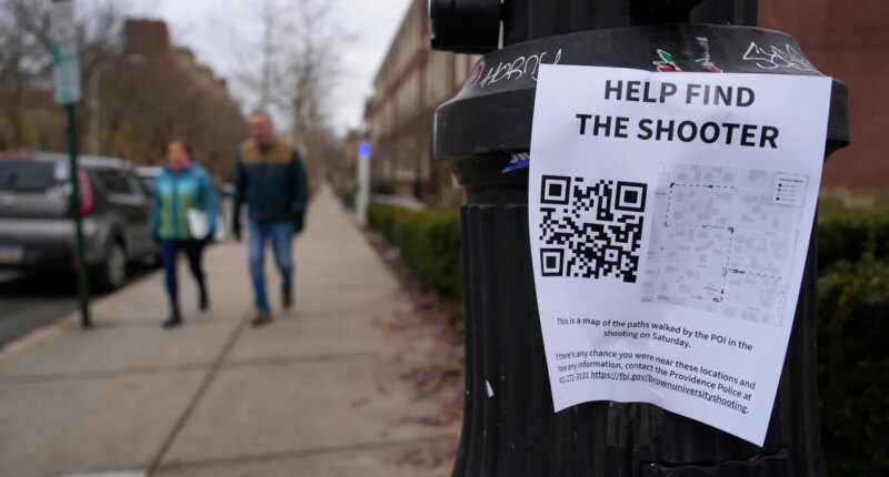 A poster seeking information about the campus shooting suspect is seen on the campus of Brown University, Wednesday, Dec. 17, 2025, in Providence, R.I. (AP Photo/Robert F. Bukaty)
