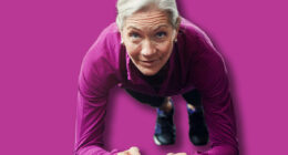 Mature woman, plank and gym on floor with balance for strong core muscle with vision for wellness. Person, training and workout for abdomen, stomach and challenge for development at fitness club