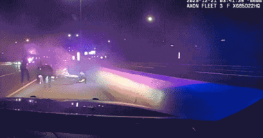 Illinois officers crawl under burning car to save trapped driver in dramatic Interstate 88 rescue