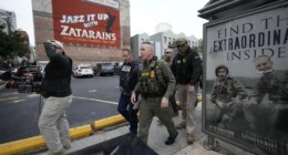 U.S. Border Patrol Commander at large Gregory Bovino, 3rd left, walks on the street in New Orleans, La.,Wednesday, Dec. 3, 2025. (AP Photo/Gerald Herbert)