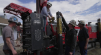 Matthew, Anna, Nathan and Matt Cooper prepare to drill a hole for a geothermal heat pump installation Thursday, Oct. 9, 2025, in Hamilton, Colo. (AP Photo/Brittany Peterson)