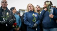 Stockton Mayor Christina Fugazi joins a vigil near the site at Thornton Blvd. and Lucile Ave., where a mass shooting took place Saturday at a banquet hall in Stockton, Calif., Sunday, Nov. 30, 2025. (Brontë Wittpenn/San Francisco Chronicle via AP)