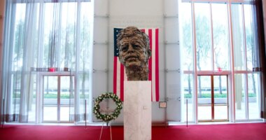 FILE - A memorial wreath stands next to the bronze memorial bust by Robert Berks of President John F. Kennedy in the grand foyer at the John F. Kennedy Center for the Performing Arts in Washington, Nov. 22, 2013, on the 50th anniversary of Kennedy