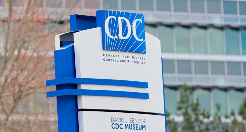 FILE - A sign with the CDC logo is displayed at the entrance to the agency