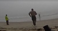 LA deputies caught on camera racing into foggy ocean to rescue disoriented paragliders