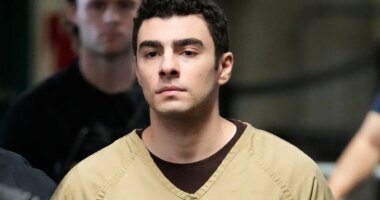 FILE - Luigi Mangione is escorted into Manhattan state court in New York, Sept. 16, 2025. (AP Photo/Seth Wenig, file)