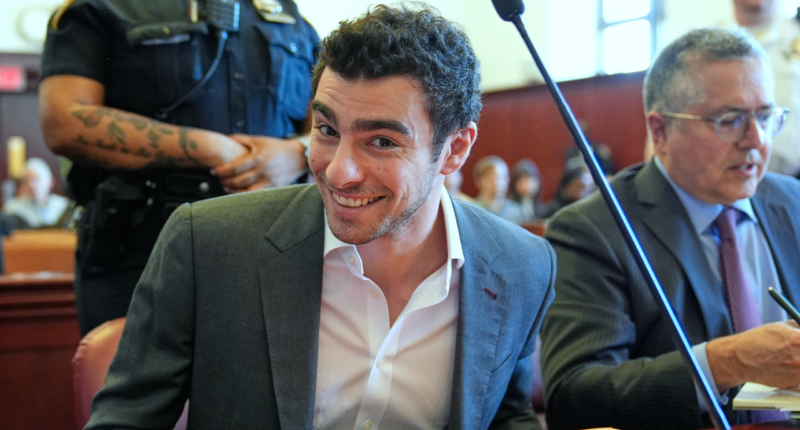 Luigi Mangione smiles for cameras in court as defense claims police violated his rights