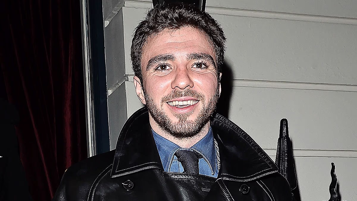 Madonna is seen with ex-husband Guy Ritchie and son Rocco for the first time since 2008 as they attend his latest art exhibition