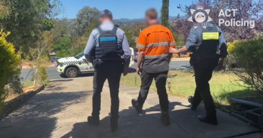The man allegedly performed two separate Nazi salutes directed towards individuals at suburban Canberra shopping centres.