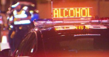 The driver of a red Holden Commodore mounted a footpath, rammed a police car and almost hit a Channel 9 camera man to avoid getting breath tested.