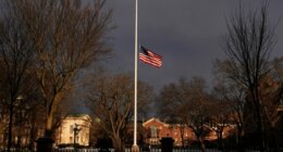 The U.S. flag flies at half-staff on the Main Green in honor of the victims of the campus shooting at Brown University, Wednesday, Dec. 17, 2025, in Providence, R.I. (AP Photo/Robert F. Bukaty)