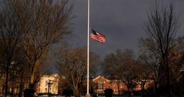 The U.S. flag flies at half-staff on the Main Green in honor of the victims of the campus shooting at Brown University, Wednesday, Dec. 17, 2025, in Providence, R.I. (AP Photo/Robert F. Bukaty)