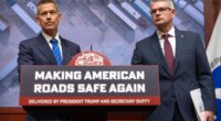 Transportation Secretary Sean Duffy, left, and Derek Barrs, Administrator of the Federal Motor Carrier Safety Administration, listen to a reporter