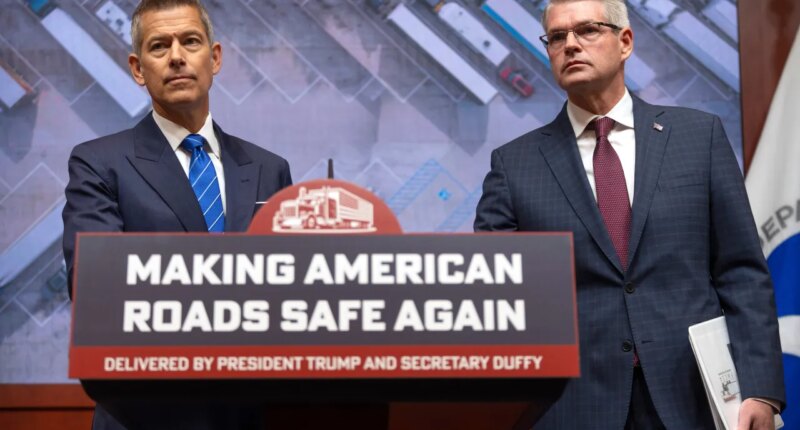 Transportation Secretary Sean Duffy, left, and Derek Barrs, Administrator of the Federal Motor Carrier Safety Administration, listen to a reporter