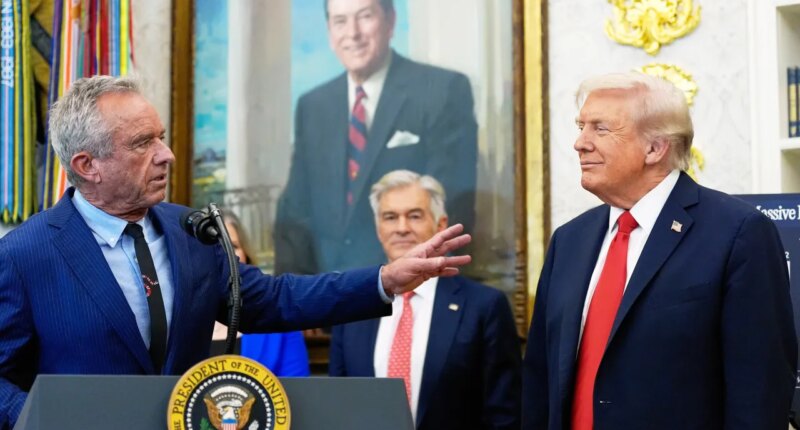 FILE - President Donald Trump listens as Health and Human Services Secretary Robert F. Kennedy Jr., speaks in the Oval Office of the White House, Oct. 16, 2025, in Washington. (AP Photo/Alex Brandon, File)