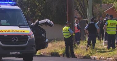 The trapped police officer has been freed from the vehicle.