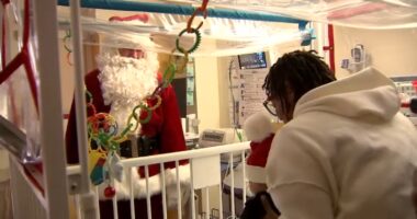 Santa Claus visits La Rabida Children's Hospital on Chicago's South Side on Christmas Day