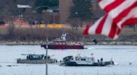 FILE - A diving team and police boat is seen near a wreckage site in the Potomac River, from Ronald Reagan Washington National Airport, Jan. 30, 2025, in Arlington, Va. (AP Photo/Jose Luis Magana, File)