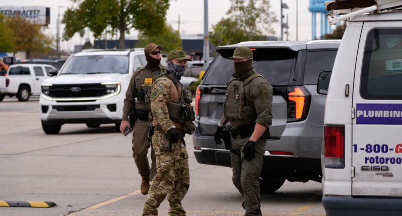U.S. Border Patrol agents arrive at a Home Depot in Kenner, La.,Wednesday, Dec. 3, 2025. (AP Photo/Gerald Herbert)