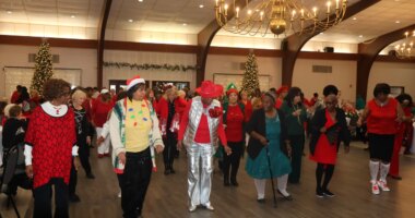 SmartSenior 2025 holiday party filled with dancing, celebrating health