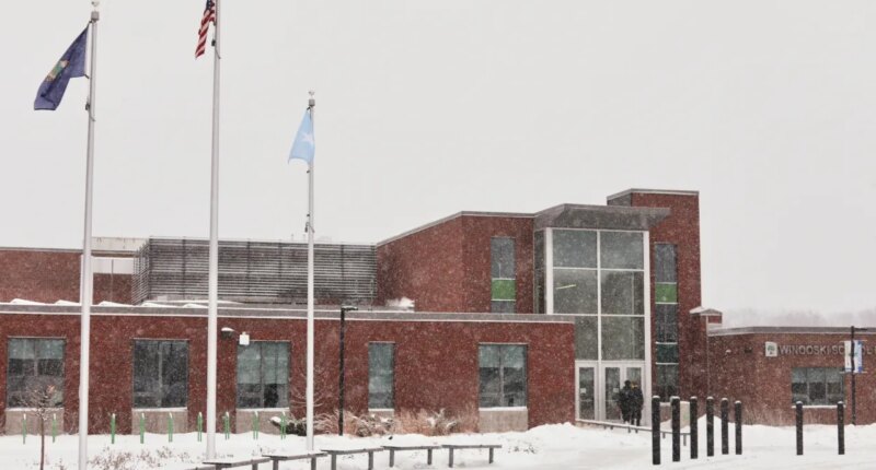 A Somali flag is flies alongside the United States and Vermont flags outside the Winooski School District building Wednesday, Dec. 10, 2025, in Winooski, Vt. (AP Photo/Amanda Swinhart)
