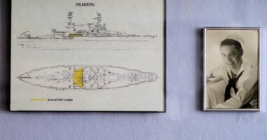 FILE - A photo of Pearl Harbor survivor Lou Conter, 101, as a young sailor is displayed at his home in Grass Valley, Calif., Nov. 18, 2022. (AP Photo/Rich Pedroncelli, File)