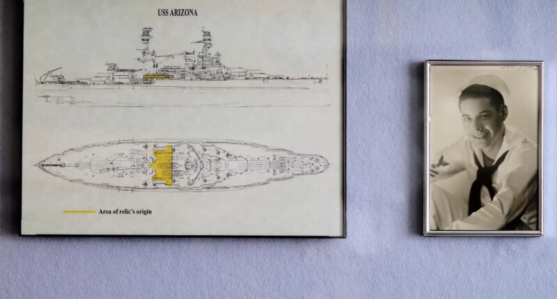 FILE - A photo of Pearl Harbor survivor Lou Conter, 101, as a young sailor is displayed at his home in Grass Valley, Calif., Nov. 18, 2022. (AP Photo/Rich Pedroncelli, File)