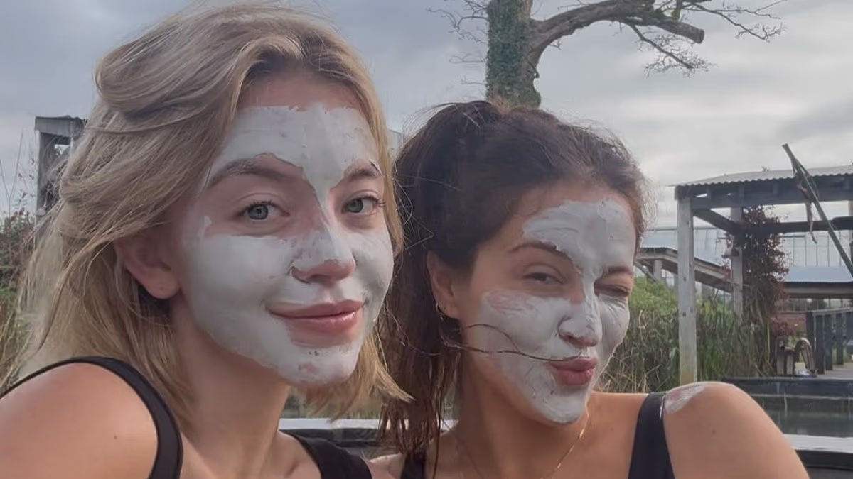 Sydney Sweeney sports a plunging swimsuit as she relaxes in a hot tub