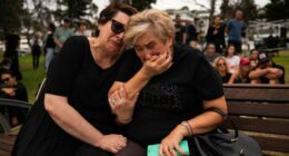 Mother and daughter, Jana and Ella embrace while gathering at Bondi Pavilion, two days after a mass shooting at Bondi Beach, on December 16, 2025 in Sydney, Australia.