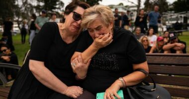 Mother and daughter, Jana and Ella embrace while gathering at Bondi Pavilion, two days after a mass shooting at Bondi Beach, on December 16, 2025 in Sydney, Australia.