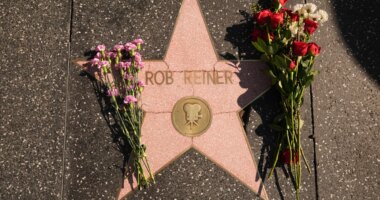 Flowers cover the Walk of Fame star for Rob Reiner Monday, Dec. 15, 2025, in the Hollywood section of Los Angeles. (AP Photo/Damian Dovarganes)