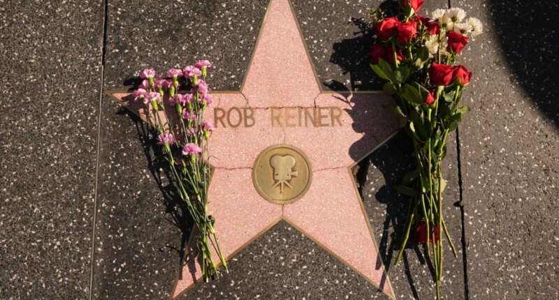 Flowers cover the Walk of Fame star for Rob Reiner Monday, Dec. 15, 2025, in the Hollywood section of Los Angeles. (AP Photo/Damian Dovarganes)