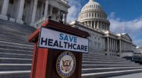 FILE - A lectern awaits the arrival of House Democrats to speak on the health care funding fight on the steps of the House at the Capitol in Washington, Nov. 12, 2025. (AP Photo/J. Scott Applewhite, File)