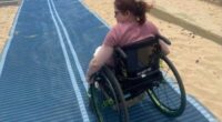 Beach matting allows people who use wheelchairs to reach the water's edge.
