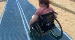 Beach matting allows people who use wheelchairs to reach the water's edge.