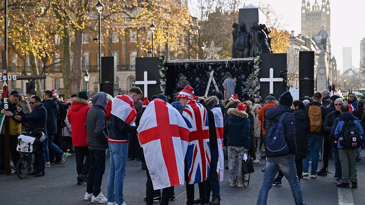 Tommy Robinson leads carol concert 'putting Christ back into Christmas' as Billy Bragg joins counter-protesters