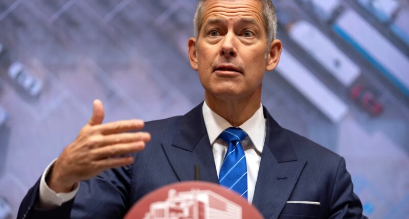Transportation Secretary Sean Duffy speaks during a news conference at the Department of Transportation in Washington, Friday, Dec. 12, 2025. (AP Photo/Mark Schiefelbein)