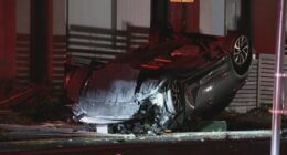 Two men were pulled from the overturned wreck of the Toyota Corolla.