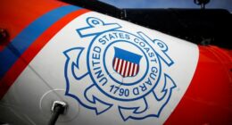FILE PHOTO: The U.S. Coast Guard's logo is seen on an helicopter on the deck of the Coast Guard Cutter Hamilton at Port Everglades, in Fort Lauderdale, Florida, U.S. November 22, 2021. REUTERS/Marco Bello/File Photo