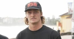 Max White, right, only avoided entering the water after a warning from his mates.