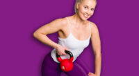 Fitness girl in one arm row position with a kettlebell