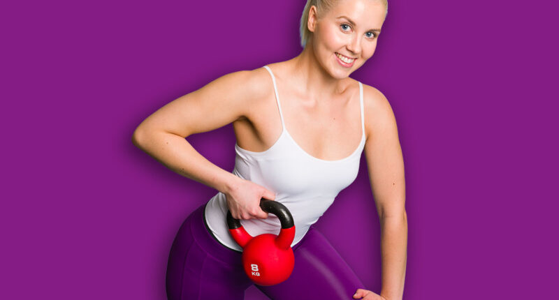Fitness girl in one arm row position with a kettlebell